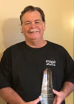 Roy Chestnut w_ Award and T-shirt 1